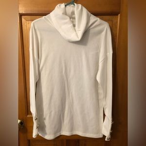 Woman’s , long sleeved, cowl neck top, with three gold buttons on cuffs